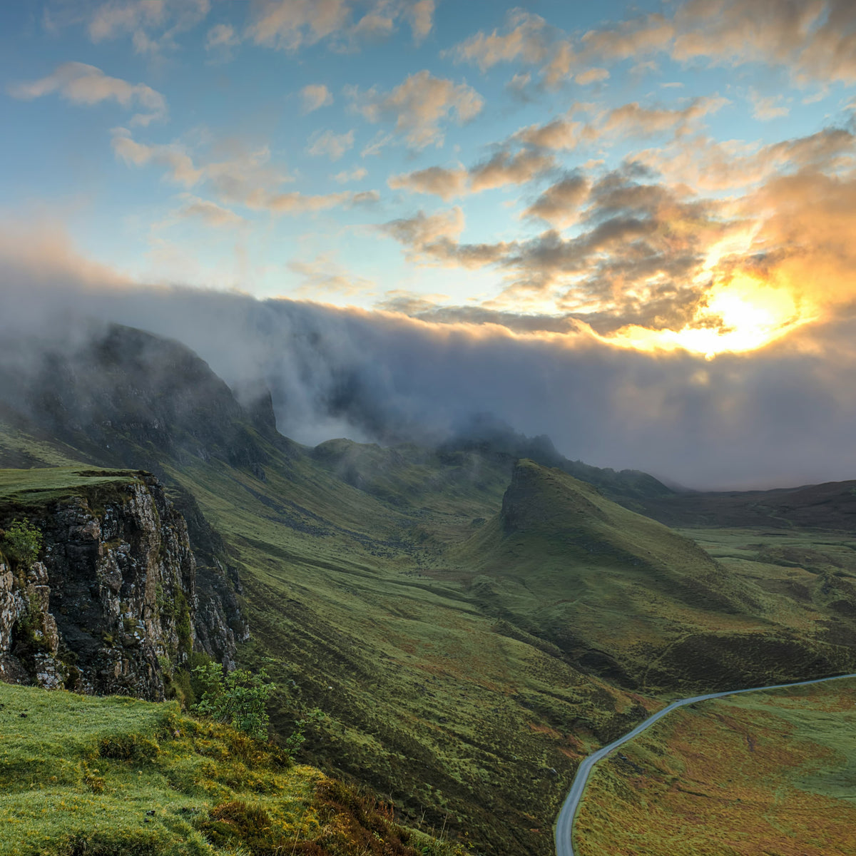 A foggy mountain landscape with lush greenery